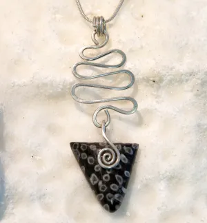 FC09P Fossilised Coral Celtic triangle pendant with wavy silver wire detail