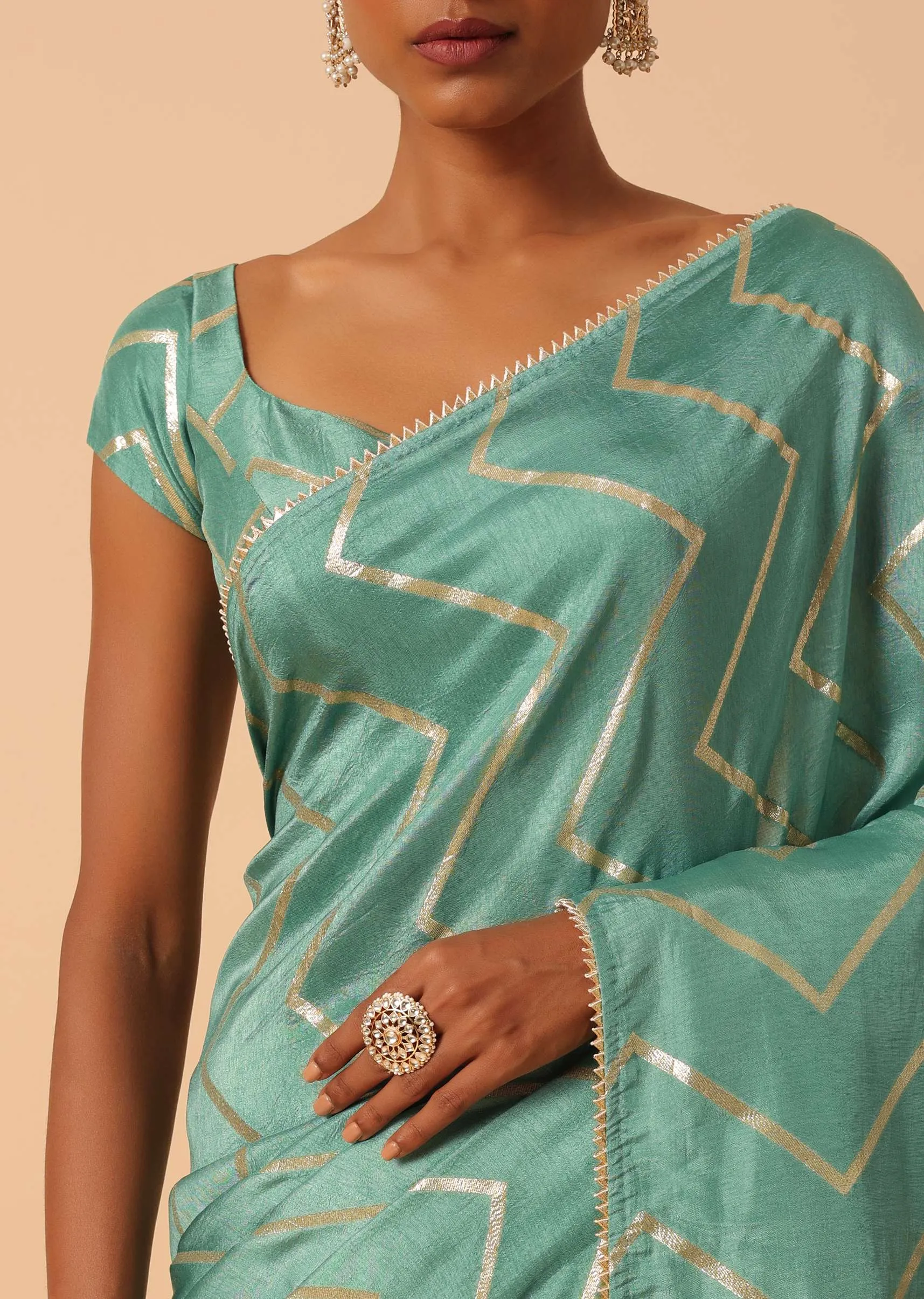 Green Dola Silk Saree With Zig Zag Lurex Work And Unstitched Blouse Piece